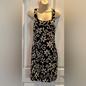 Ann Taylor Dress Size 6 Black w/cream floral. Side zip. Straps cross in back.